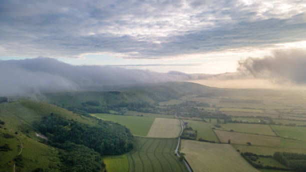 istock Aerial view of a hill with low hanging clouds. 1367235491