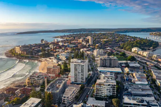 Panoramic aerial drone view above Cronulla in the Sutherland Shire, South Sydney, looking south toward Port Hacking during summer in the early morning