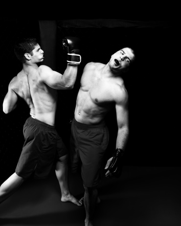 Mixed martial artists fighting - knock out