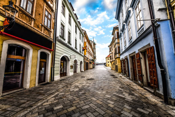 Street Leading Through Buildings With Great Architectural Features In Bratislava, Slovakia Street Leading Through Buildings With Great Architectural Features In Bratislava, Slovakia bratislava photos stock pictures, royalty-free photos & images