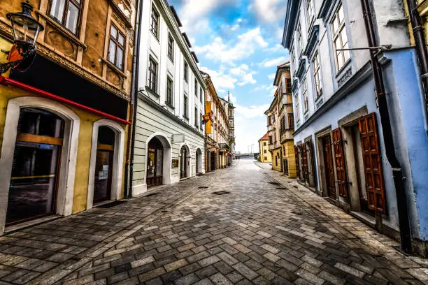 Photo of Street Leading Through Buildings With Great Architectural Features In Bratislava, Slovakia