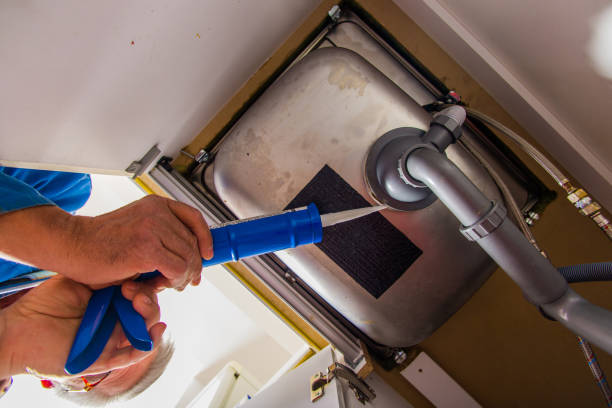 istock Repairman working with caulking gun 1367238085