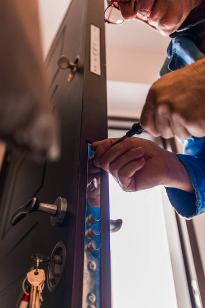 istock Workman repair door knob in hallway 1367238098