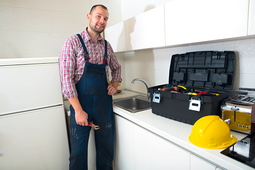 Man Using Kitchen Machine Handsome Man Standing In The Kitchen With His Toolbox Stock Photo ...