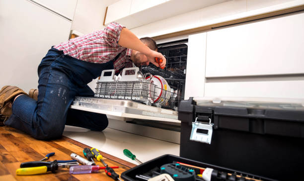 istock Handyman repair dishwasher in  the kitchen 1367239050