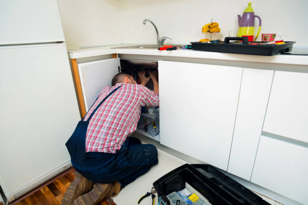 istock Handyman repair pipes on sink in the kitchen 1367239089