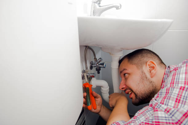 istock Plumber fixing a sink in bathroom with wrench 1367239274