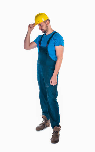 istock Portrait of a young workman standing on white background 1367240077