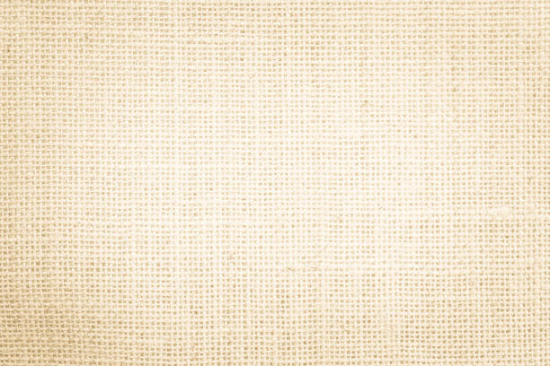 istock Jute hessian sackcloth burlap canvas woven texture background pattern in light beige cream brown color blank. Natural weaving fiber linen and cotton cloth texture as clean empty for decoration. 1367242752