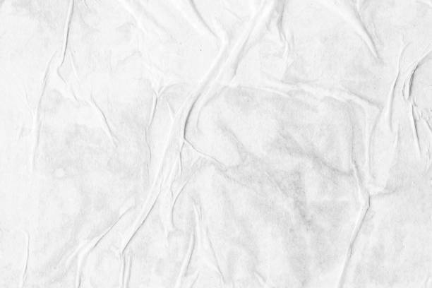 istock white crumpled and creased paper poster texture background 1367246399