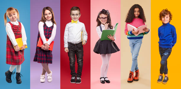istock Positive schoolkids with books looking at camera 1367247188