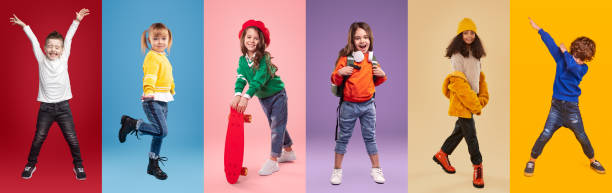 cheerful multiracial little girls and boys against vibrant background - pre adolescent child child group of people little boys imagens e fotografias de stock