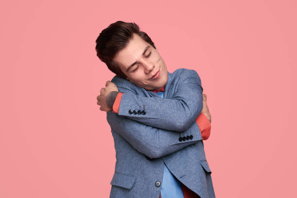 istock Dreamy young man embracing himself 1367247195