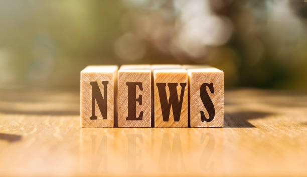 istock NEWS word on wooden blocks on table in sunlight 1367247378