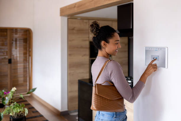 istock Woman leaving her smart home and closing the door using an automated system 1367252734