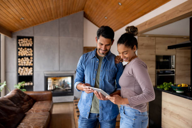 istock Couple controlling features of their house using a tablet computer 1367252860