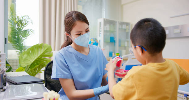 istock dentist teach about teeth health 1367254558