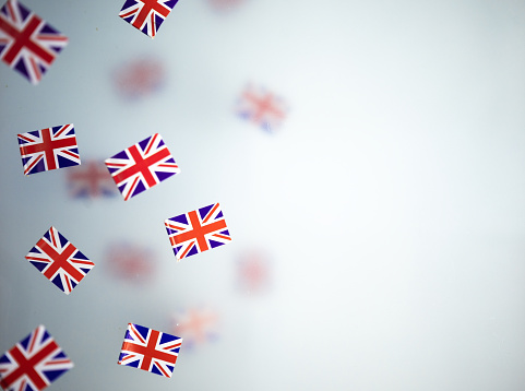 Great Britain, national holiday  country. Mini flags on a transparent foggy background.