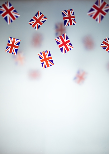 Great Britain, national holiday  country. Mini flags on a transparent foggy background.