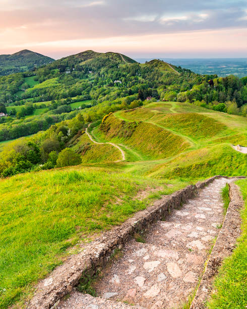 Stone steps and winding pathways running across Malvern Hills,Worcestershire,England,United Kingdom. A stepped stone path and hill trails wind their way along the legnth of the Malvern hills,with beautiful views across the surrounding counties,through a grassy undulating landscape. gloucestershire stock pictures, royalty-free photos & images