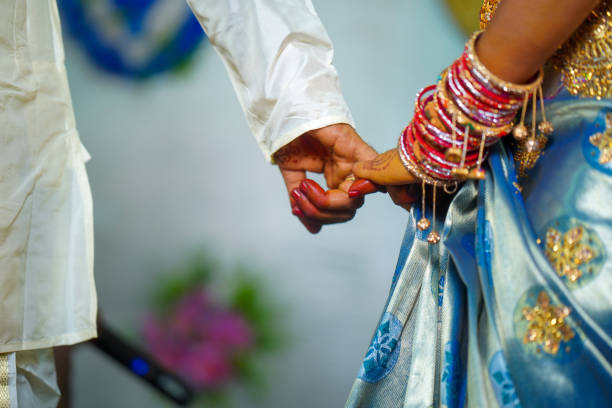 istock Bride and groom holding hands 1367258937