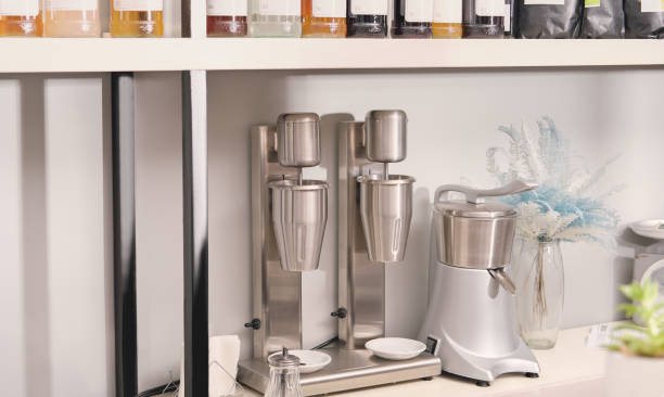 istock professional electric milk shaker for making two milkshakes standing on a bar counter. modern contemporary coffeeshop equipment. 1367259910