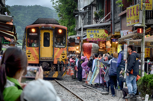 Moving Train Passes Through Heart of Shifen Old Street in Taiwan
