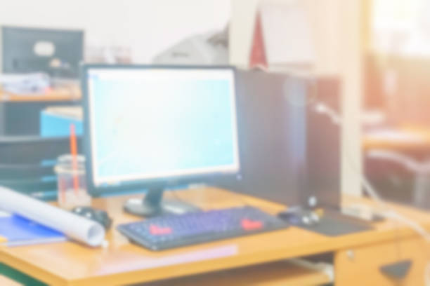 istock Blur office working computer on desk busy at building interior room, Business background with corporate confidence images, Abstract office workers and workplace blurry for technology. 1367261455
