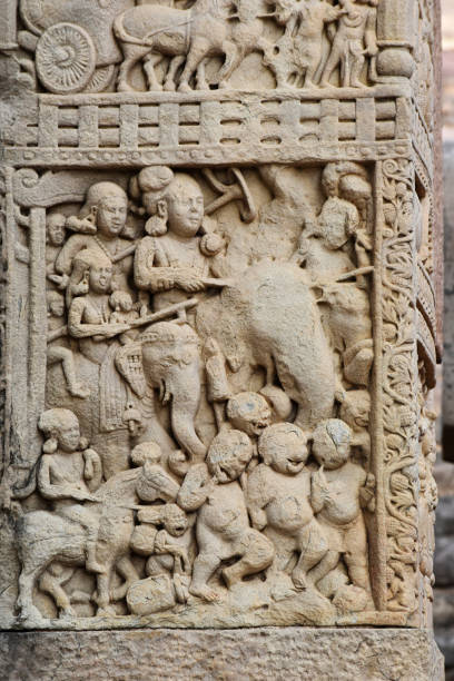 istock Stupa No 1, South Gateway, Left Pillar Front Face, Panel 3: Indra and his wife Sachi are riding elephants. World Heritage Site, Sanchi, Madhya Pradesh, India 1367275811