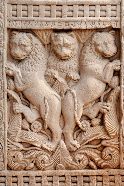 istock Stupa No 1, West Gateway, Right Pillar, Front Face, Panel 4 : The panel shows three lions one in center and two on either sides.  World Heritage Site, Sanchi, Madhya Pradesh, India 1367275904