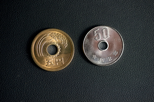 Close-up of Japanese 50-yen coin and 5-yen coin