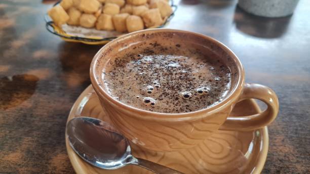 Bali robusta black coffee in a brown cup on a cafe table