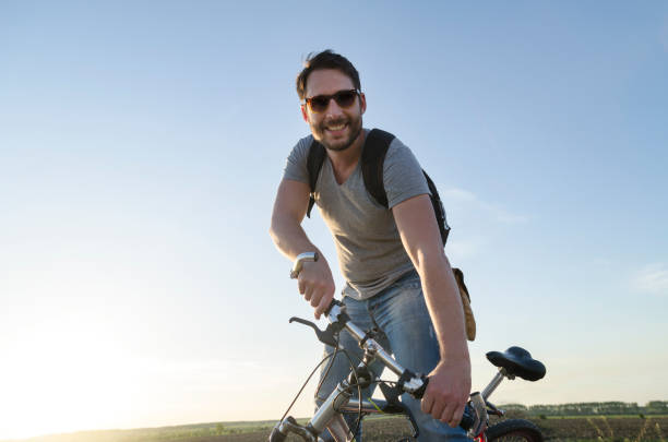 istock Man riding a bike 1367280995