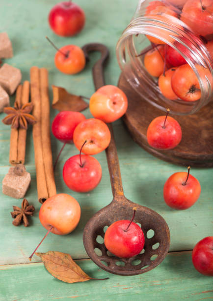istock paradise apples, on the wooden table in the rustic style, iron mug 1367286785