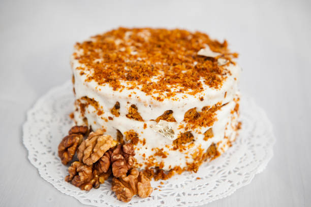 Homemade cake with honey and walnuts on a light background