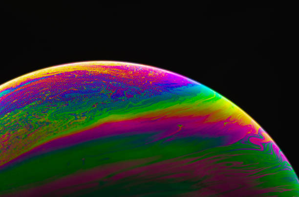 istock Virtual reality space with abstract multicolor psychedelic planet. Closeup Soap bubble like an alien planet on black background. 1367290612