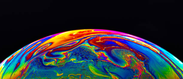 istock Virtual reality space with abstract multicolor psychedelic planet. Closeup Soap bubble like an alien planet on black background. 1367290680