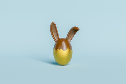golden easter egg with chocolate bunny ears. 3d rendering