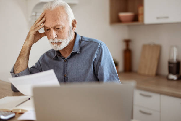 istock Worried Senior Man Analyzing Home Finances 1367292880