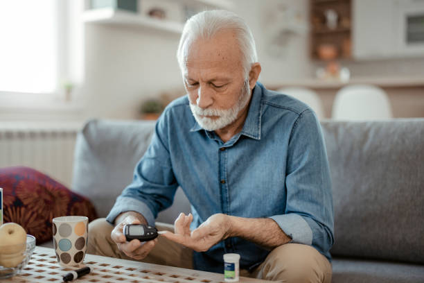 istock Senior Man With Glucometer Checking Blood Sugar Level 1367294472