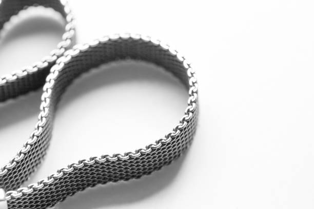 istock Rolled braided silver ribbon bracelet is on white 1367295166
