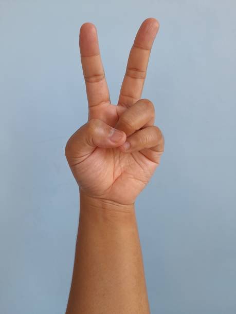 istock Peace Hand Sign. Person Peace Sign. 1367297941