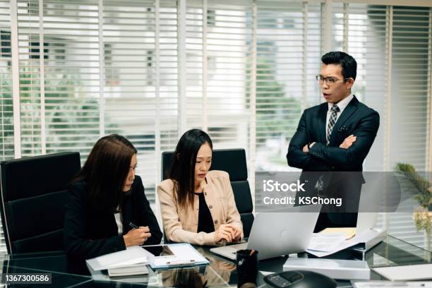 An Asian Manager Is Insulting His Colleague In Conference Room Stock Photo - Download Image Now