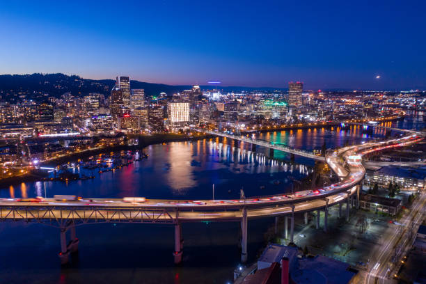 Aerial view of downtown Portland at dusk Aerial view of Portland, Oregon at dusk portland oregon photos stock pictures, royalty-free photos & images