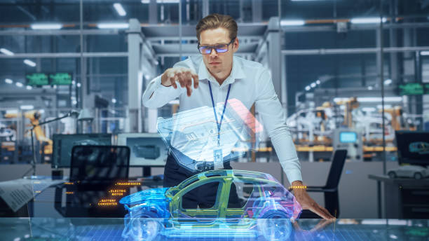 istock Sustainable Industrial Design: Portrait of Modern Automotive Engineer Using Augmented Reality to Construct 3D Hologram Model of High-Tech Electric Car. Automated Vehicle Manufacturing Facility 1367303239