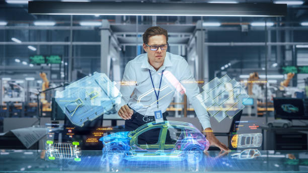 istock Sustainable Industrial Design: Portrait of Modern Automotive Engineer Using Augmented Reality to Construct 3D Hologram Model of High-Tech Electric Car. Automated Vehicle Manufacturing Facility 1367303250
