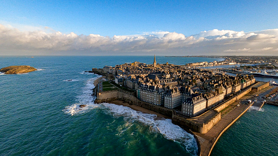 Fort National on a tidal island off the coast of the walled city of Saint-Malo in France with a Great black-backed gull standing on the wall. The fort is a medieval fortress with a turbulent history and is currently a popular tourist attraction.