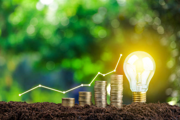 istock Financial growth graph, coins and glowing light bulb 1367307652