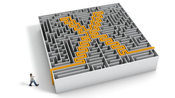 istock 3D illustration of X-shaped maze with a man entering 1367307809