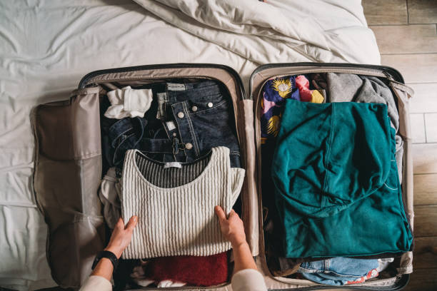 istock A woman is packing for her next trip 1367312069